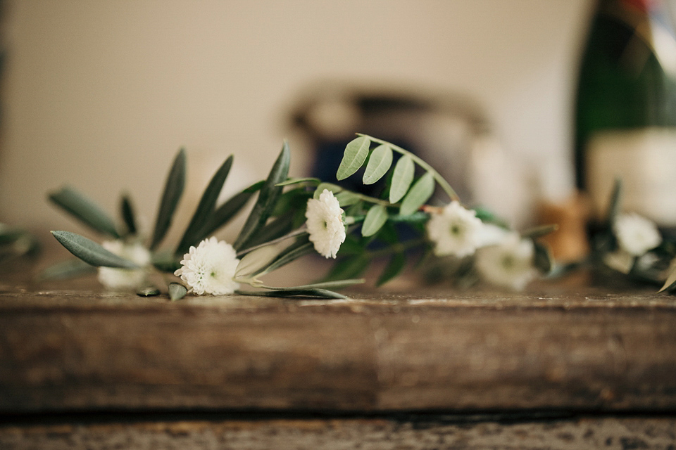 A first look and floral crown for an elegant and intimate chateau wedding in the South of France. Photography by Sabestien Boudot.