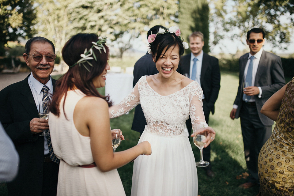 A first look and floral crown for an elegant and intimate chateau wedding in the South of France. Photography by Sabestien Boudot.