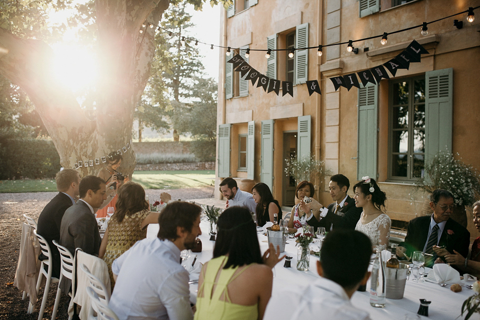 A first look and floral crown for an elegant and intimate chateau wedding in the South of France. Photography by Sabestien Boudot.