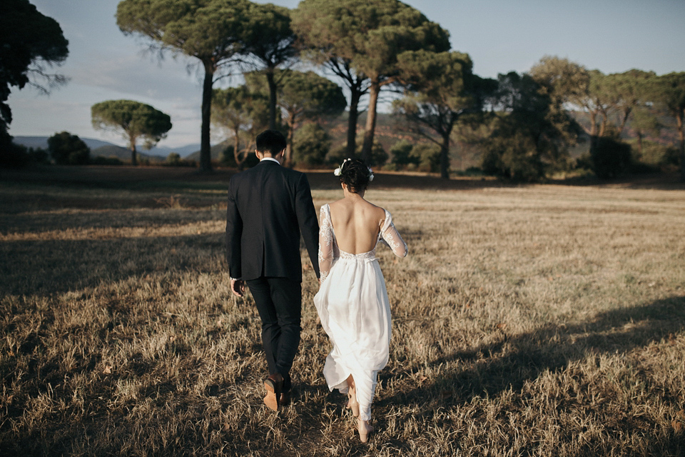 A first look and floral crown for an elegant and intimate chateau wedding in the South of France. Photography by Sabestien Boudot.