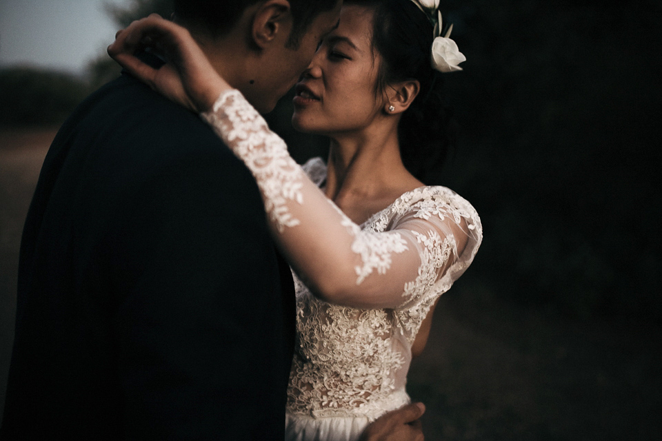 A first look and floral crown for an elegant and intimate chateau wedding in the South of France. Photography by Sabestien Boudot.