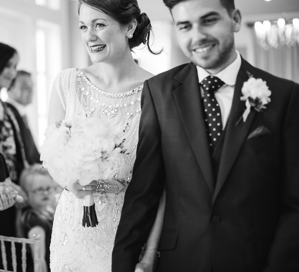 Bride Meg wears Eden by Jenny Packham for her 1920s and Great Gatsby inspired wedding at the Woodlands Hotel in Leeds. Photography by Cat Hepple.