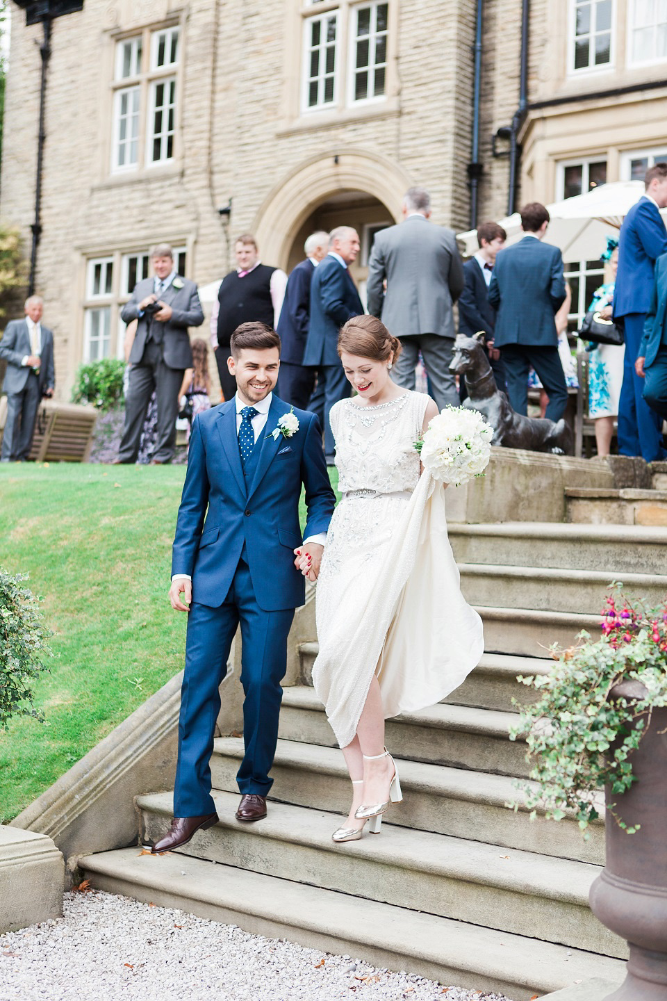 Bride Meg wears Eden by Jenny Packham for her 1920s and Great Gatsby inspired wedding at the Woodlands Hotel in Leeds. Photography by Cat Hepple.