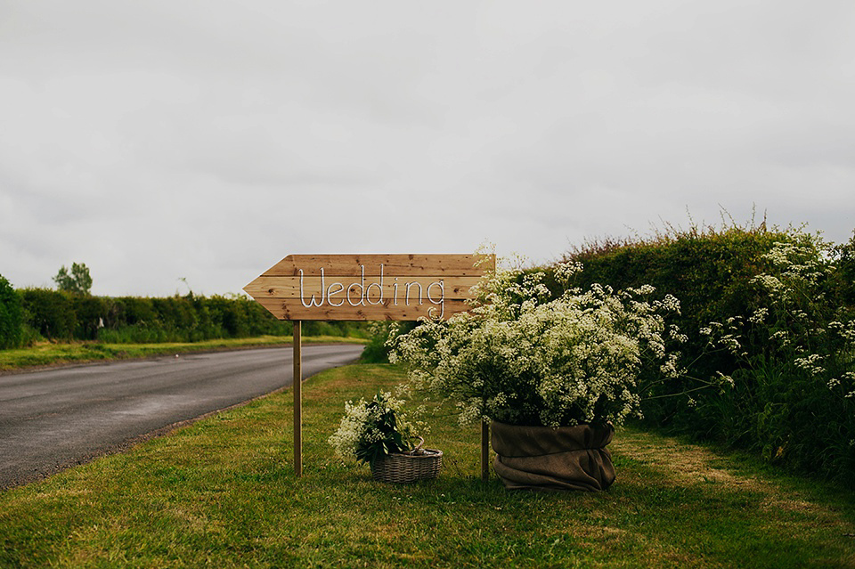 Tartan shoes and a Flowerdog for a Homemade Farm Wedding in Northumberland. Photography by Anna Urban.