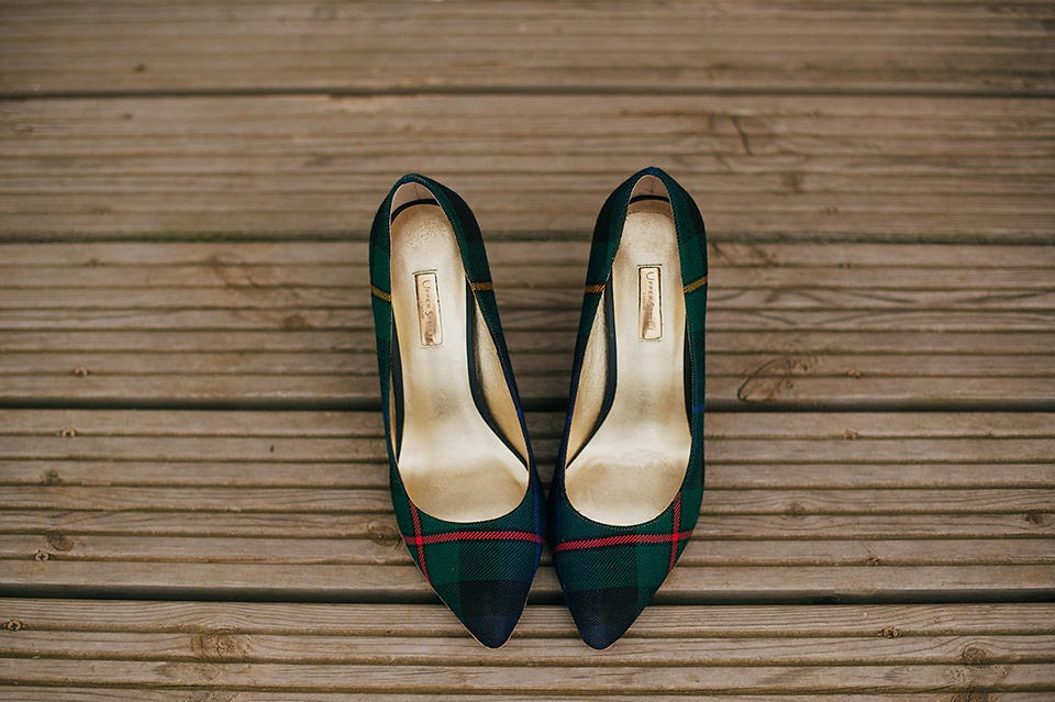 Tartan shoes and a Flowerdog for a Homemade Farm Wedding in Northumberland. Photography by Anna Urban.