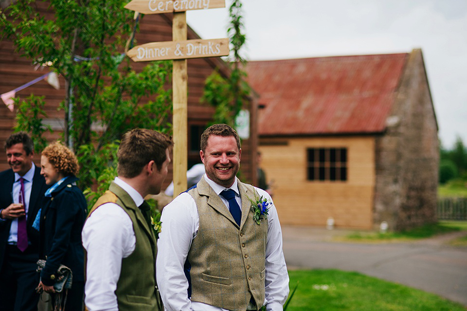 Tartan shoes and a Flowerdog for a Homemade Farm Wedding in Northumberland. Photography by Anna Urban.