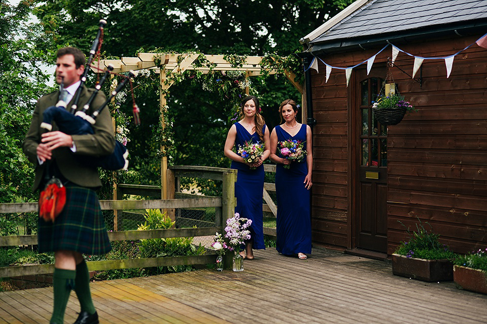 Tartan shoes and a Flowerdog for a Homemade Farm Wedding in Northumberland. Photography by Anna Urban.