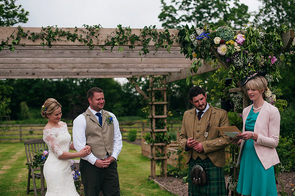 Tartan shoes and a Flowerdog for a Homemade Farm Wedding in Northumberland. Photography by Anna Urban.