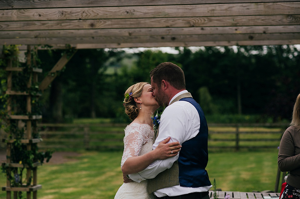 Tartan shoes and a Flowerdog for a Homemade Farm Wedding in Northumberland. Photography by Anna Urban.