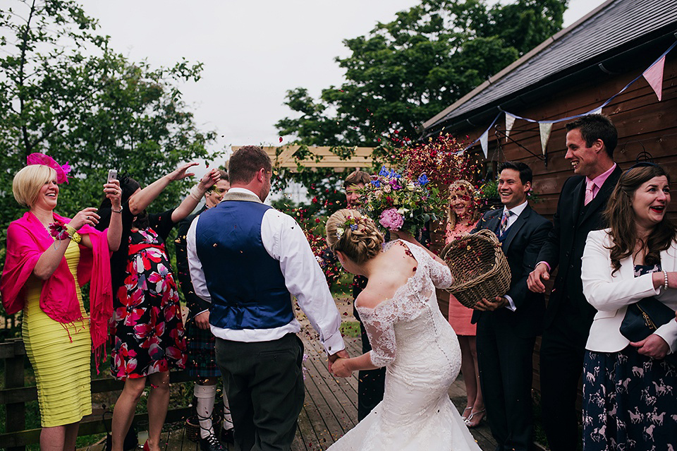 Tartan shoes and a Flowerdog for a Homemade Farm Wedding in Northumberland. Photography by Anna Urban.