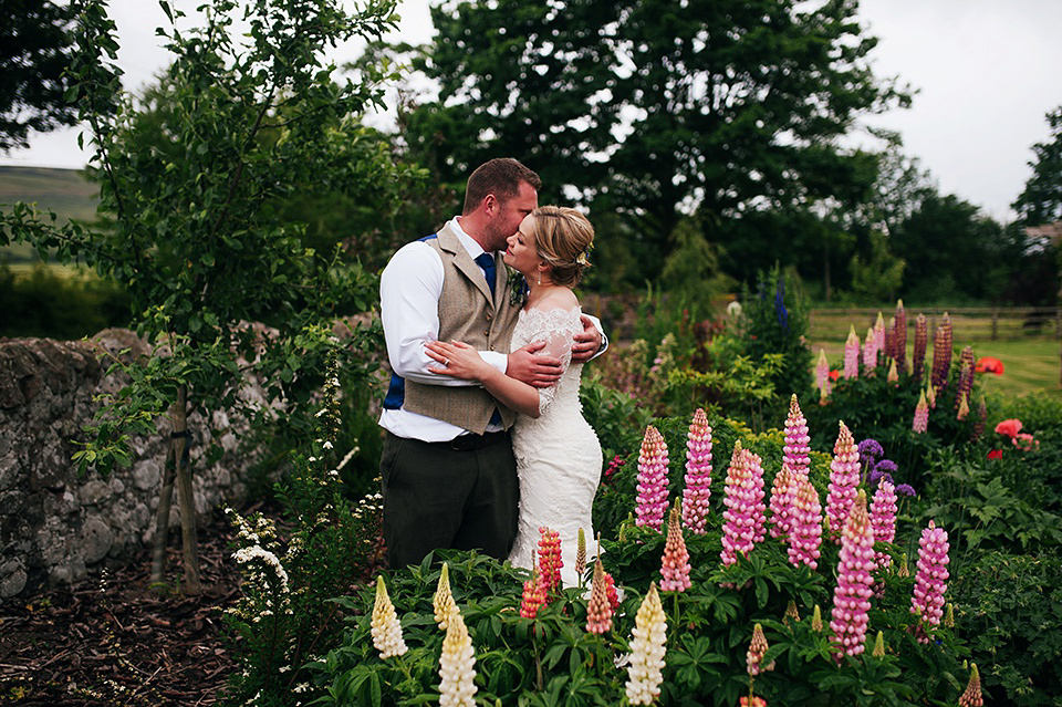 Tartan shoes and a Flowerdog for a Homemade Farm Wedding in Northumberland. Photography by Anna Urban.