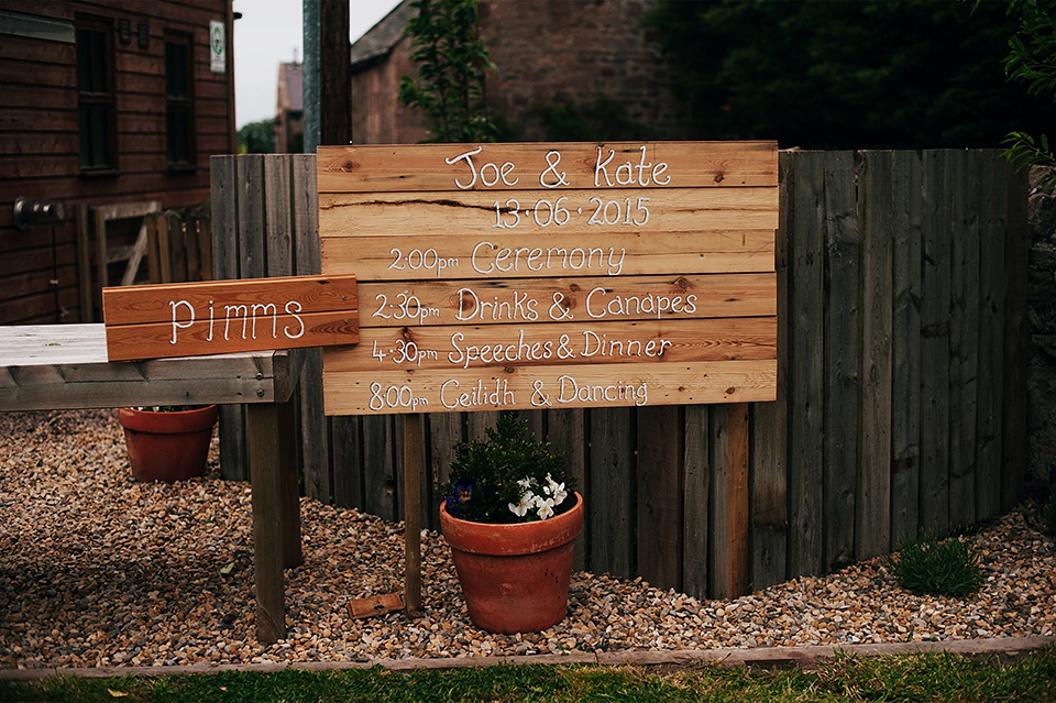 Tartan shoes and a Flowerdog for a Homemade Farm Wedding in Northumberland. Photography by Anna Urban.