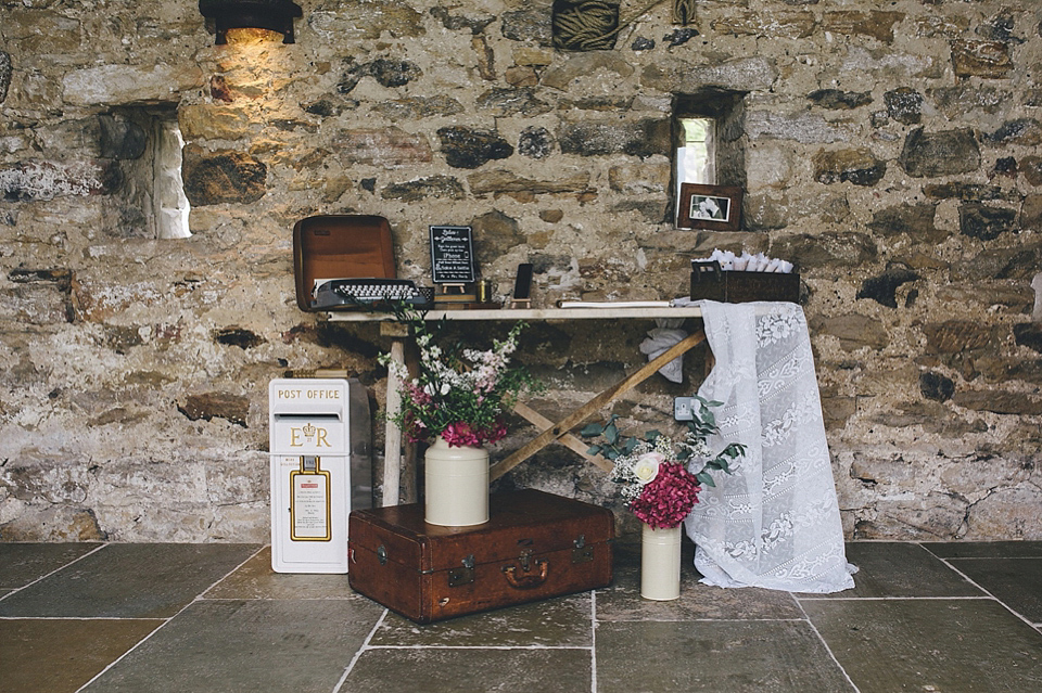 The bride wears Essense of Australia for her rustic wedding at Healey Barn, Northumberland. Photography by The Twins.