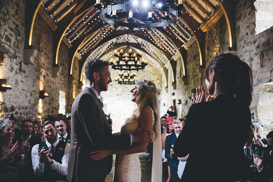 The bride wears Essense of Australia for her rustic wedding at Healey Barn, Northumberland. Photography by The Twins.