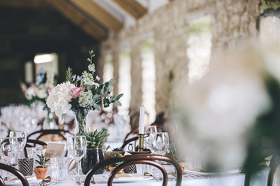 The bride wears Essense of Australia for her rustic wedding at Healey Barn, Northumberland. Photography by The Twins.