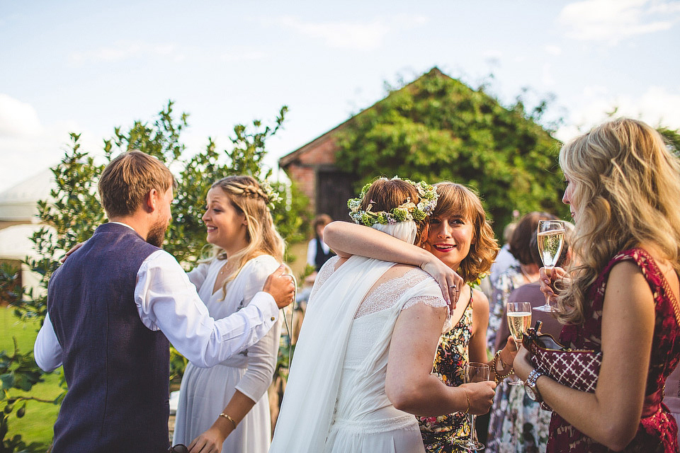 Bride Pip wore a handmade dress for her rustic wedding on her parent's Orchard farm. Photography by S6 Photography.