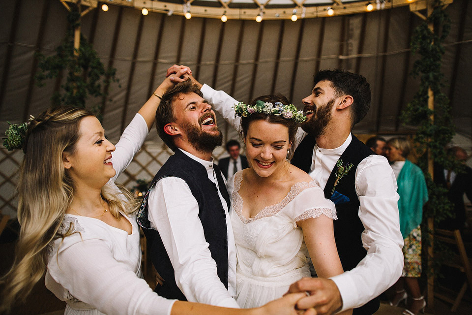 Bride Pip wore a handmade dress for her rustic wedding on her parent's Orchard farm. Photography by S6 Photography.