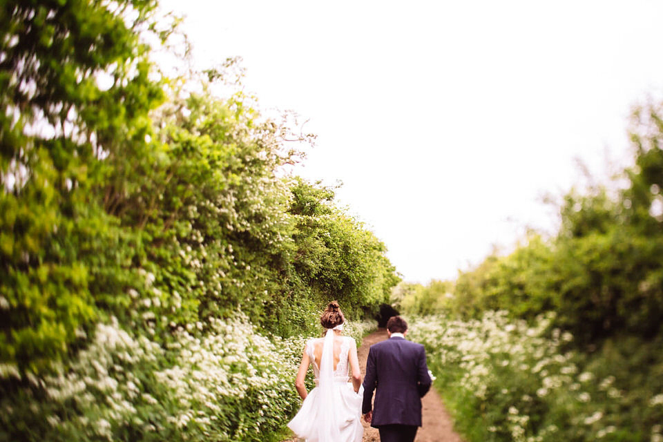 A Rime Arodaky Dress and Lace Headband For A Daisy Inspired Farm Wedding. Bride Daisy found her dress at The Mews of Notting Hill. Photography by Joe Hall.