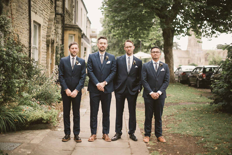 An elegant English countryside barn wedding in Oxfordshire. Photography by Tom Ravenshear. The bride wears a dress by designer Sienna Von Hildemar