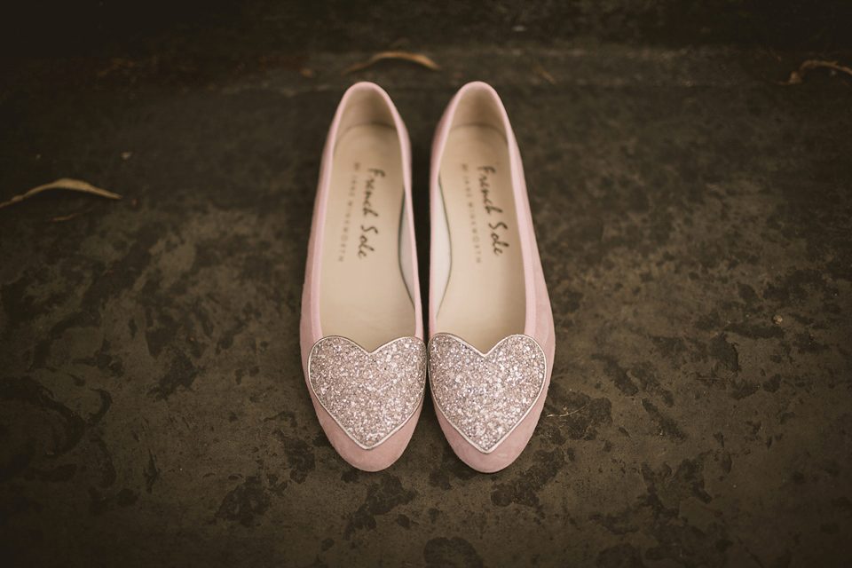 An elegant English countryside barn wedding in Oxfordshire. Photography by Tom Ravenshear. The bride wears a dress by designer Sienna Von Hildemar