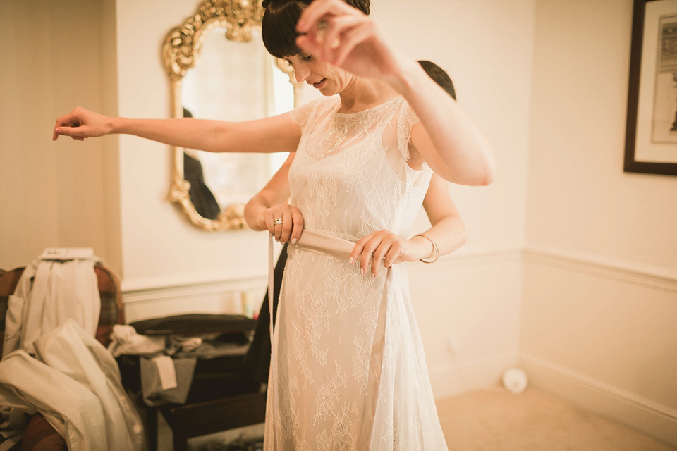 An elegant English countryside barn wedding in Oxfordshire. Photography by Tom Ravenshear. The bride wears a dress by designer Sienna Von Hildemar