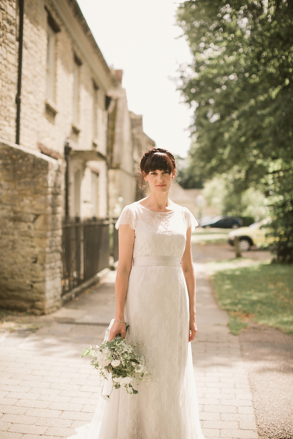 An elegant English countryside barn wedding in Oxfordshire. Photography by Tom Ravenshear. The bride wears a dress by designer Sienna Von Hildemar