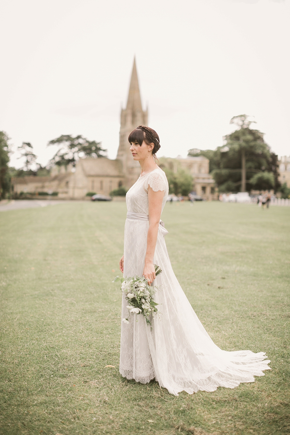 An elegant English countryside barn wedding in Oxfordshire. Photography by Tom Ravenshear. The bride wears a dress by designer Sienna Von Hildemar