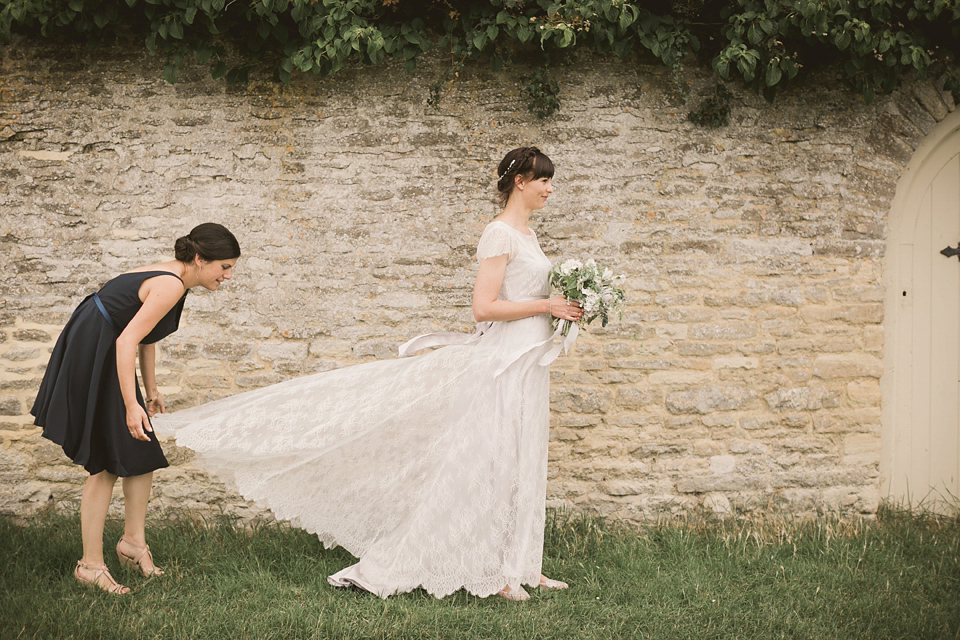 An elegant English countryside barn wedding in Oxfordshire. Photography by Tom Ravenshear. The bride wears a dress by designer Sienna Von Hildemar