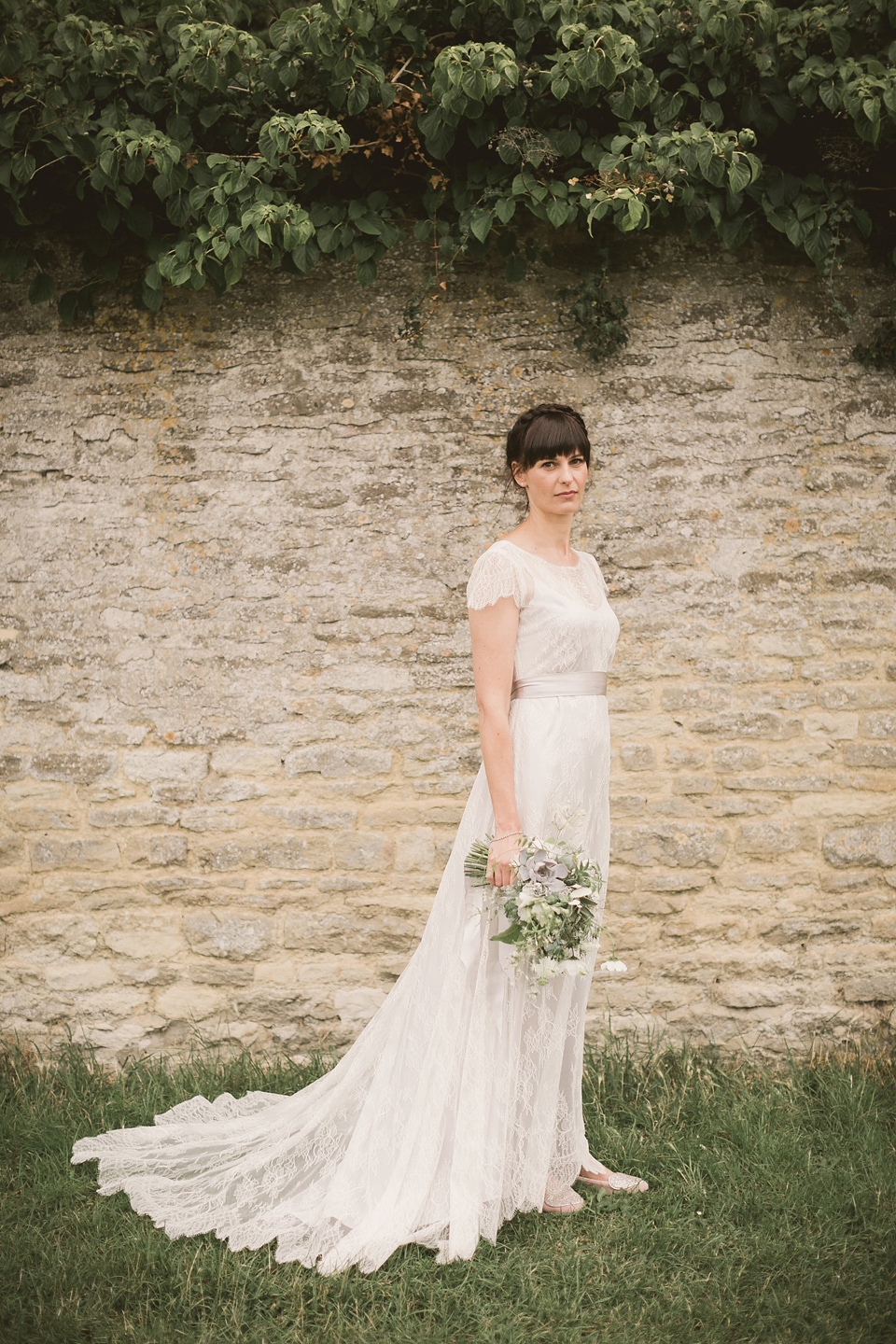 An elegant English countryside barn wedding in Oxfordshire. Photography by Tom Ravenshear. The bride wears a dress by designer Sienna Von Hildemar