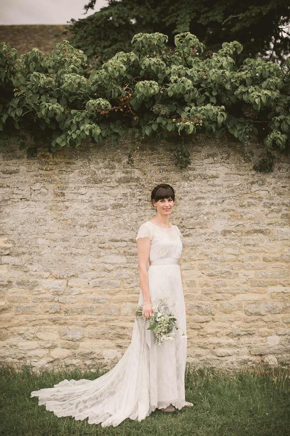 An elegant English countryside barn wedding in Oxfordshire. Photography by Tom Ravenshear. The bride wears a dress by designer Sienna Von Hildemar