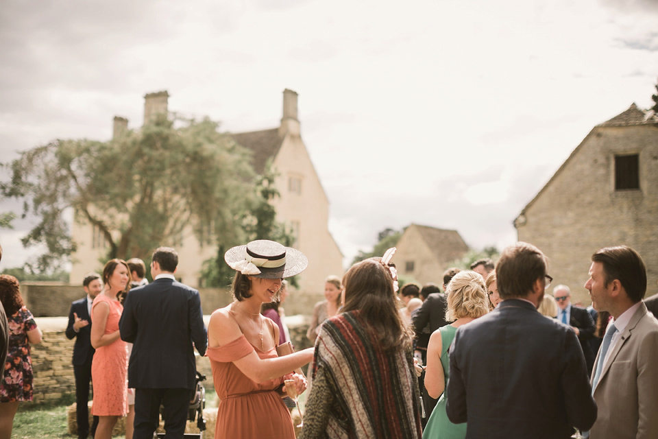 An elegant English countryside barn wedding in Oxfordshire. Photography by Tom Ravenshear. The bride wears a dress by designer Sienna Von Hildemar