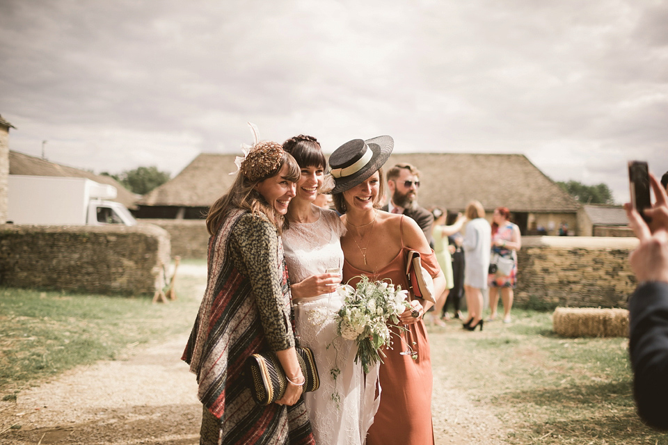 An elegant English countryside barn wedding in Oxfordshire. Photography by Tom Ravenshear. The bride wears a dress by designer Sienna Von Hildemar