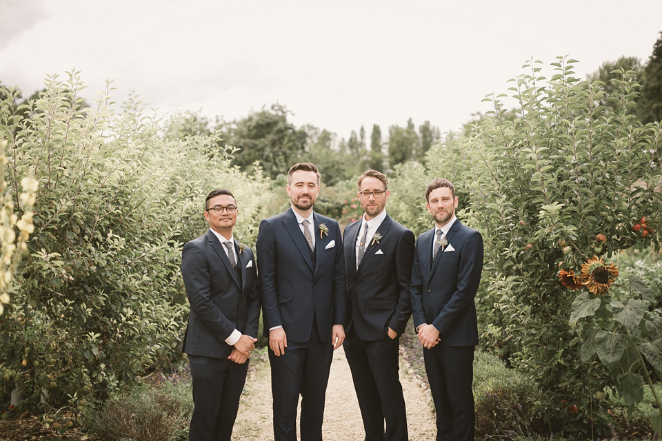 An elegant English countryside barn wedding in Oxfordshire. Photography by Tom Ravenshear. The bride wears a dress by designer Sienna Von Hildemar