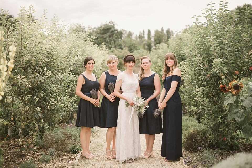 An elegant English countryside barn wedding in Oxfordshire. Photography by Tom Ravenshear. The bride wears a dress by designer Sienna Von Hildemar