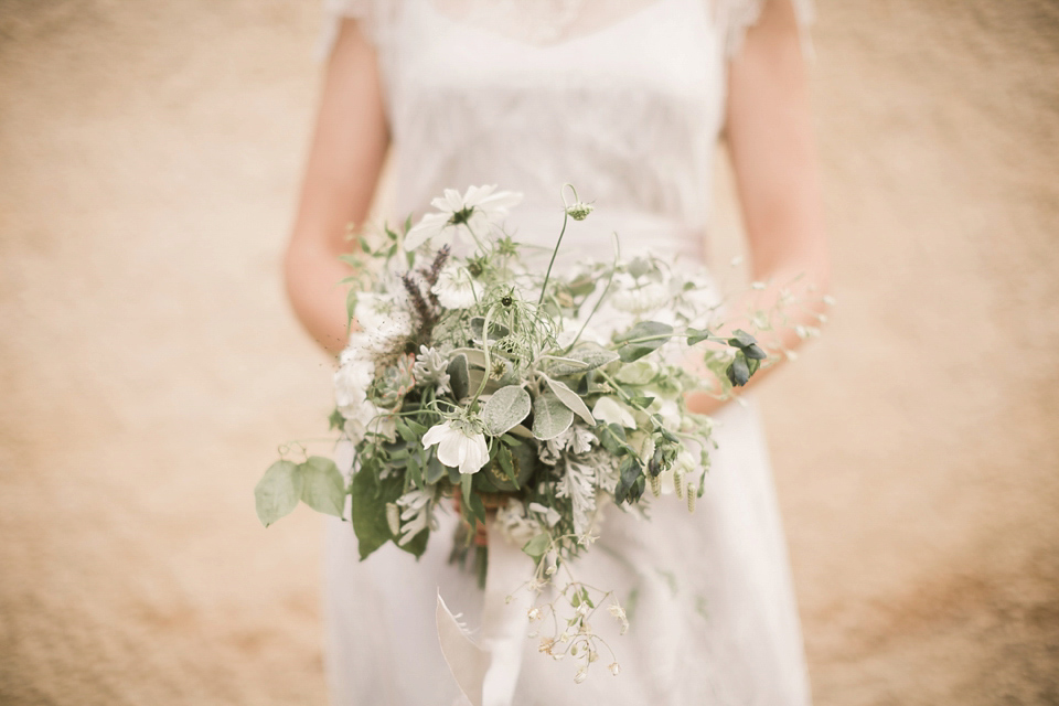 An elegant English countryside barn wedding in Oxfordshire. Photography by Tom Ravenshear. The bride wears a dress by designer Sienna Von Hildemar