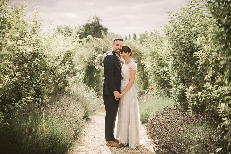 An elegant English countryside barn wedding in Oxfordshire. Photography by Tom Ravenshear. The bride wears a dress by designer Sienna Von Hildemar