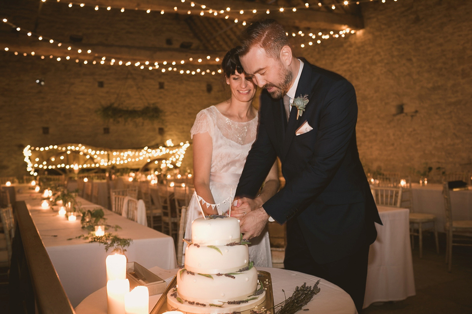 An elegant English countryside barn wedding in Oxfordshire. Photography by Tom Ravenshear. The bride wears a dress by designer Sienna Von Hildemar