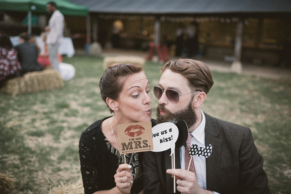 An elegant English countryside barn wedding in Oxfordshire. Photography by Tom Ravenshear. The bride wears a dress by designer Sienna Von Hildemar