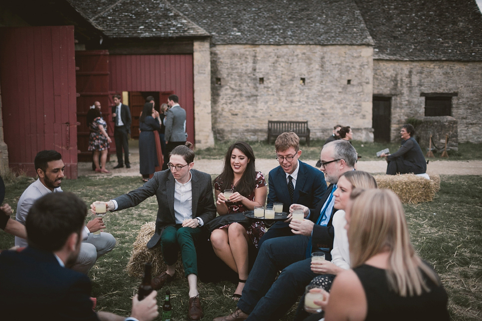 An elegant English countryside barn wedding in Oxfordshire. Photography by Tom Ravenshear. The bride wears a dress by designer Sienna Von Hildemar