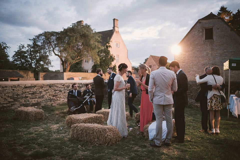 An elegant English countryside barn wedding in Oxfordshire. Photography by Tom Ravenshear. The bride wears a dress by designer Sienna Von Hildemar