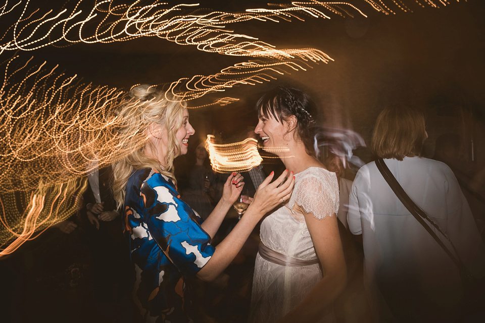 An elegant English countryside barn wedding in Oxfordshire. Photography by Tom Ravenshear. The bride wears a dress by designer Sienna Von Hildemar