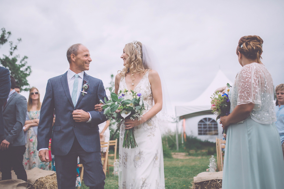 Bride Jo wears a Claire Pettibone gown and vintage tiara for her colourful, homespun and humanist wedding celebration. Photography by Naomi Jane Photography.