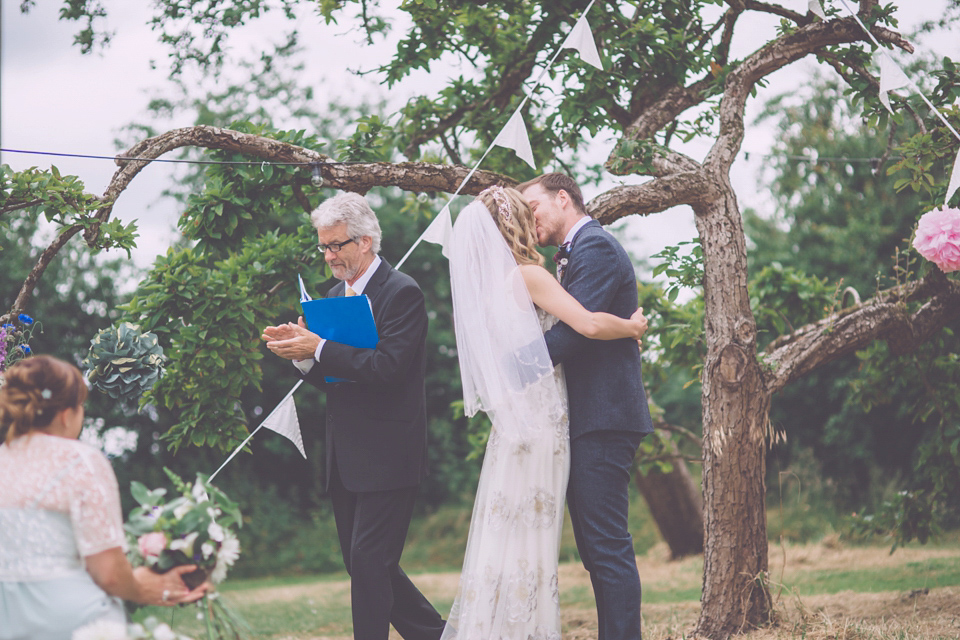 Bride Jo wears a Claire Pettibone gown and vintage tiara for her colourful, homespun and humanist wedding celebration. Photography by Naomi Jane Photography.