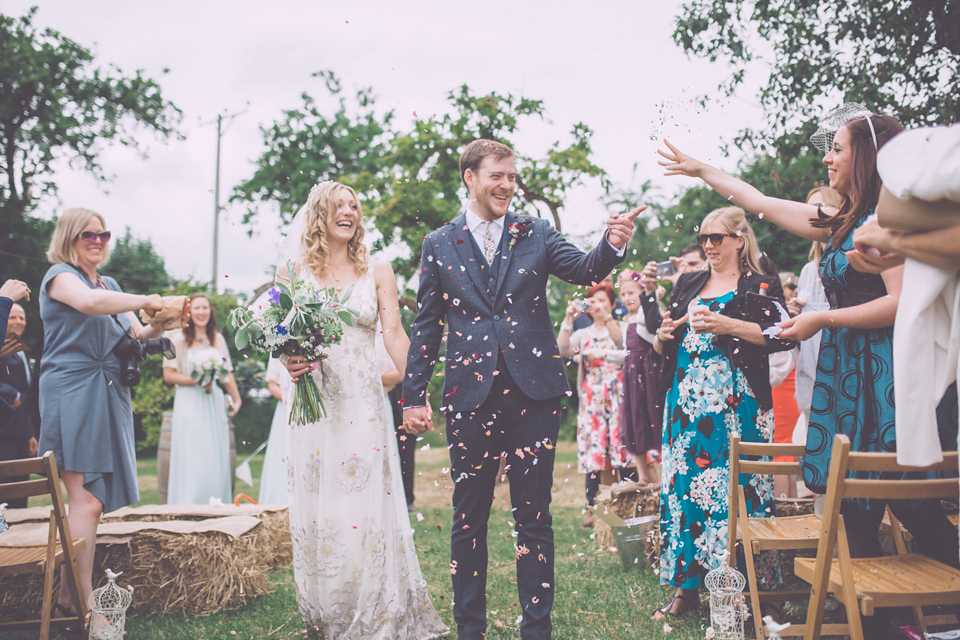 Bride Jo wears a Claire Pettibone gown and vintage tiara for her colourful, homespun and humanist wedding celebration. Photography by Naomi Jane Photography.