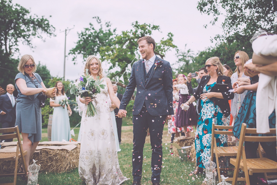 Bride Jo wears a Claire Pettibone gown and vintage tiara for her colourful, homespun and humanist wedding celebration. Photography by Naomi Jane Photography.