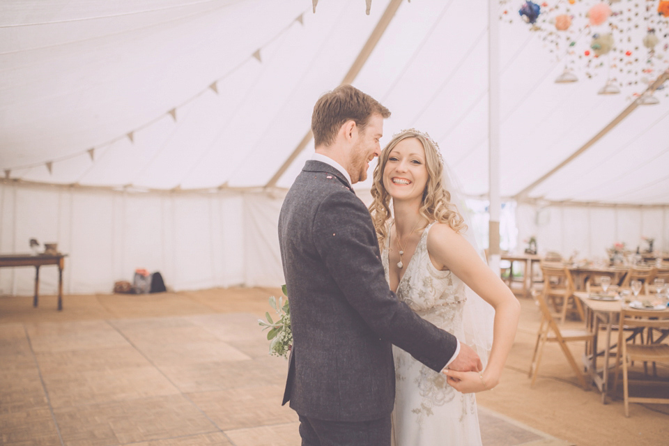 Bride Jo wears a Claire Pettibone gown and vintage tiara for her colourful, homespun and humanist wedding celebration. Photography by Naomi Jane Photography.