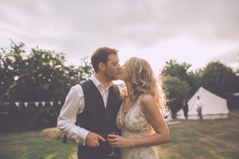 Bride Jo wears a Claire Pettibone gown and vintage tiara for her colourful, homespun and humanist wedding celebration. Photography by Naomi Jane Photography.