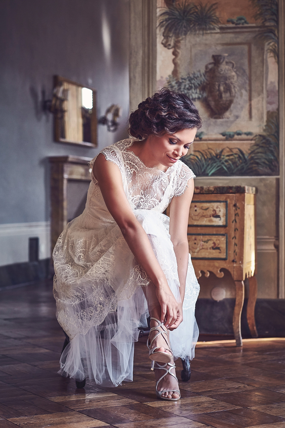 A short, lace, Rembo Styling wedding dress and shades of navy blue for a garden blessing in Tuscany. Photography by Jules Bower.