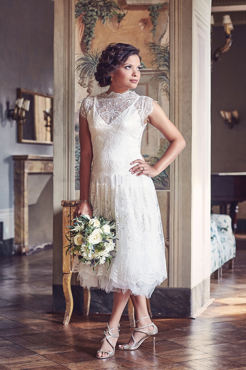 A short, lace, Rembo Styling wedding dress and shades of navy blue for a garden blessing in Tuscany. Photography by Jules Bower.