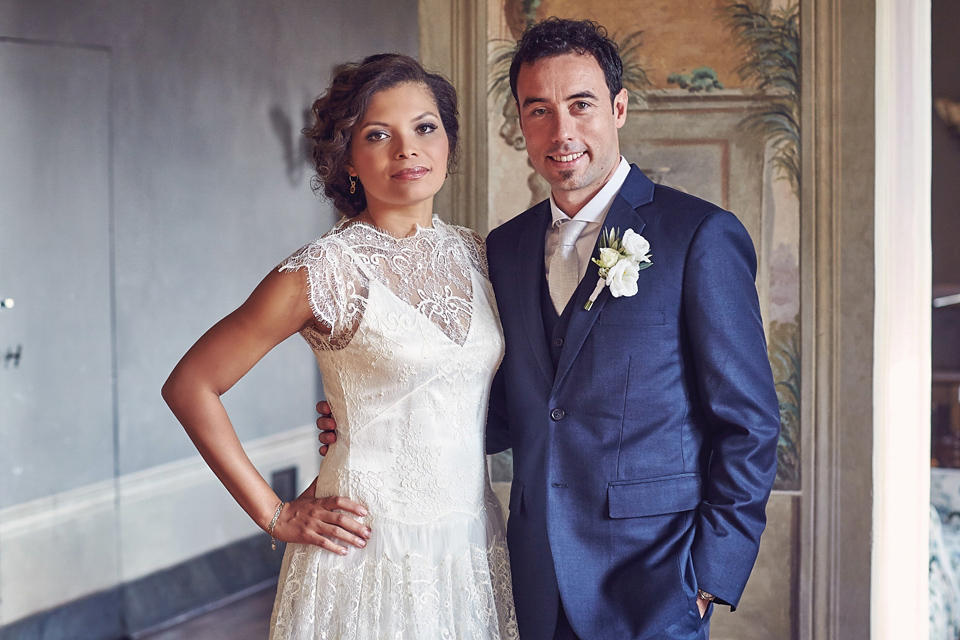 A short, lace, Rembo Styling wedding dress and shades of navy blue for a garden blessing in Tuscany. Photography by Jules Bower.